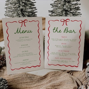 May include: Two festive menu cards with red and green accents. One card reads "Menu" and lists starters, salad, entree, and dessert. The other card says "the Bar" and lists wine, beer, cocktails, and non-alcoholic drinks.