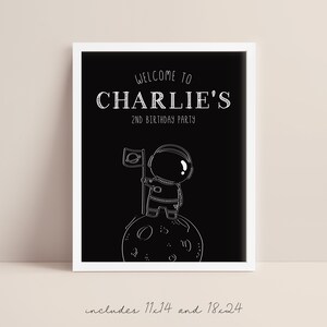 May include: Black and white printable sign with a white astronaut illustration standing on the moon. The sign says "Welcome to Charlie's 2nd Birthday Party".