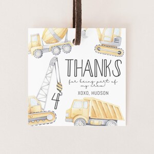May include: Yellow construction vehicle thank you tags with a watercolor design. The tags say "Thanks for being part of my crew! XOXO, HUDSON".