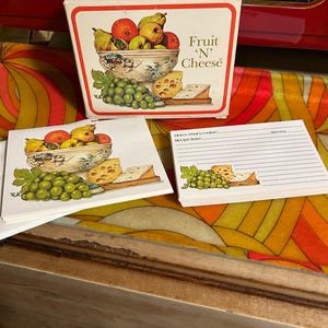 May include: A box of Fruit 'N' Cheese recipe cards. The box has a colorful illustration of a bowl of fruit and cheese. The cards are blank and ready to be filled with your favorite recipes.