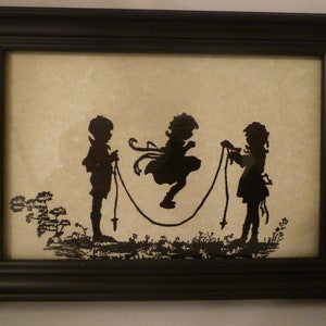 SILHOUETTES OF CHILDREN At Play. Wall Decor / Stand. Vintage Style Framed Silhouette Print Depicting Children At Play. Children Jump Roping.