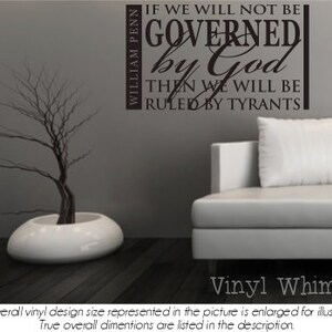 May include: A black and white vinyl wall decal with the quote "If we will not be governed by God, then we will be ruled by tyrants." attributed to William Penn. The quote is displayed on a gray wall with a white vase and a white couch in the background.