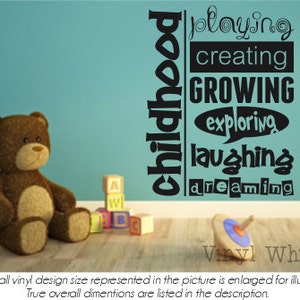 May include: Black and white vinyl wall decal with the words "childhood", "playing", "creating", "growing", "exploring", "laughing", and "dreaming". The decal is on a light blue wall with a brown teddy bear and colorful blocks in the foreground.