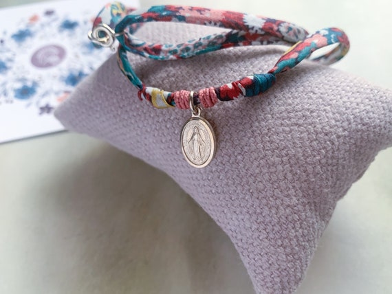 Liberty cord necklace for girls with a small Miraculous medal.