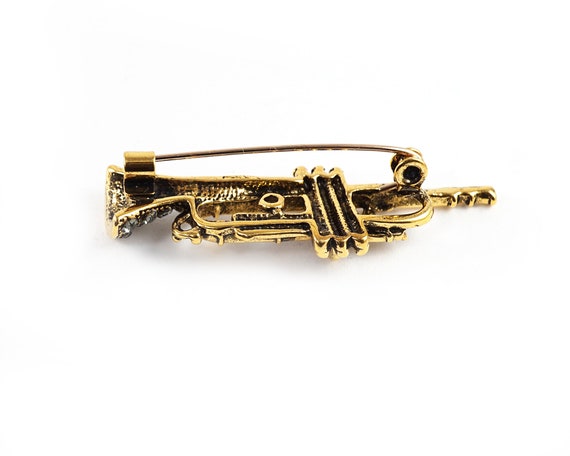 Trumpet brooch on sale