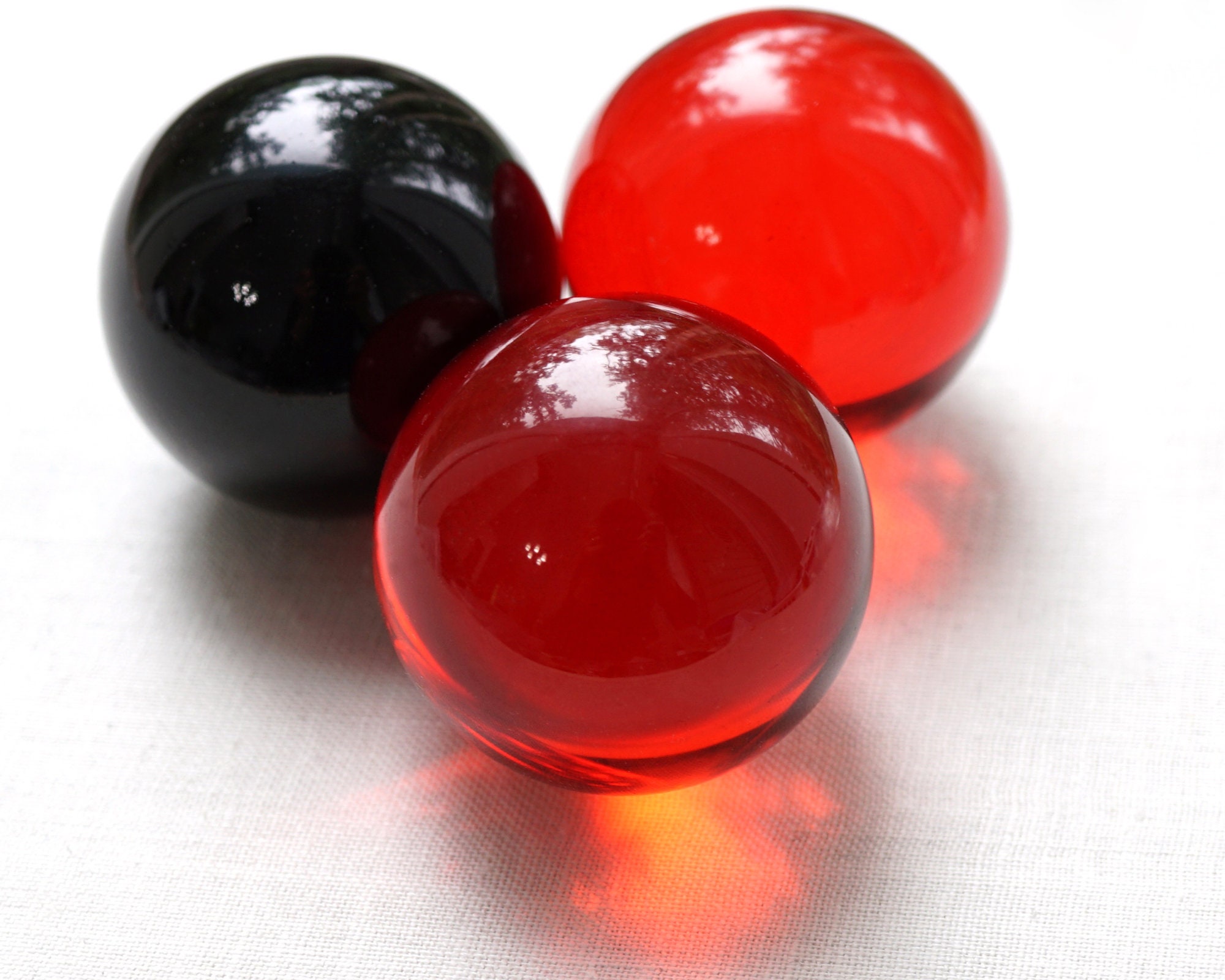 Round we go by Sarah Lust on   Glass marbles, Red glass, Black and  gold marble
