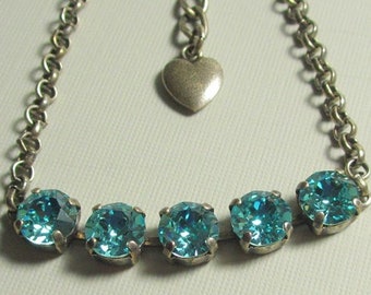 A Sparkling Light Turquoise Crystal Bracelet that is Adjustable