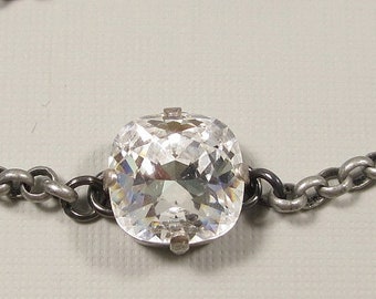 A Beautiful Bracelet in Antique Silver with a Sparkling Cushion Cut Clear Crystal at the center