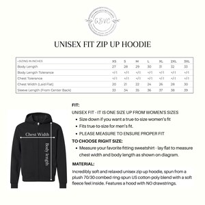May include: Black unisex zip-up hoodie with a hood, shown with a sizing chart in inches. The chart details body length, chest width, and sleeve length for sizes XS to 3XL. The hoodie is made of a soft cotton-poly blend.