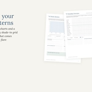 May include: Two white paper sheets featuring printed tracking templates. One sheet is titled Week 1 Review with a grid chart and lines for notes. The other is titled Monthly Overview with a large shade-in grid and sections for reflections.
