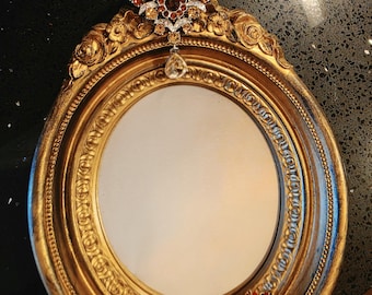 Upcycled sparkly brooch mirror