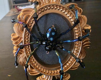 Sparkly spider in mini vintage style frame