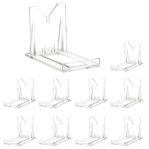May include: Ten clear plastic display stands for showcasing items like plates, figurines, or other collectibles. The stands are designed to elevate and angle the displayed object.