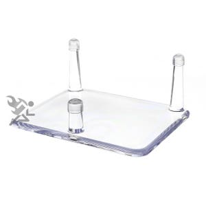 May include: A clear acrylic display stand with three prongs for displaying small objects. The stand is rectangular and has a smooth, polished surface.