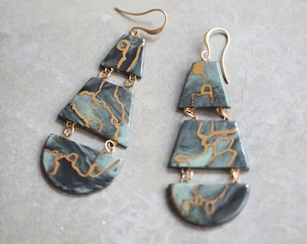 Tukituki, porcelain and metal earrings.