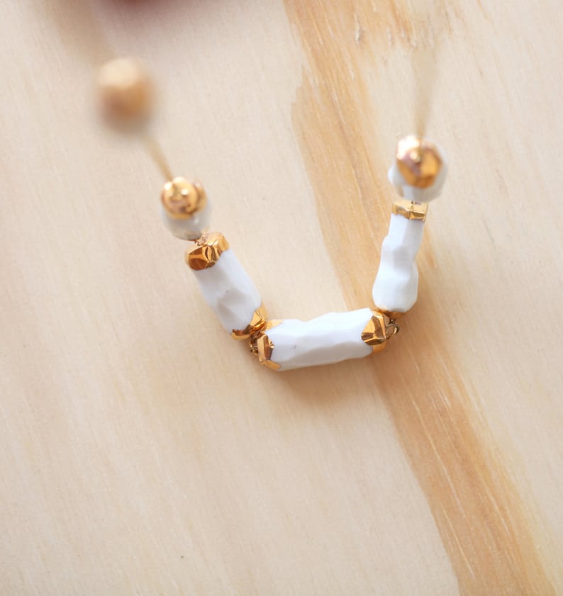 Cachoiera. Earth drop necklace in porcelain and gold. image 1