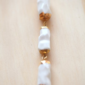 Cachoiera. Earth drop necklace in porcelain and gold. image 3