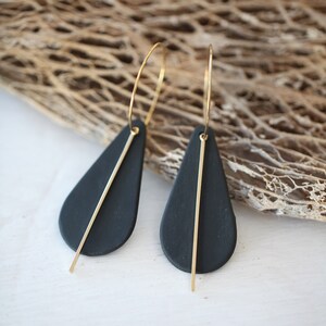 notoro, porcelain and metal earrings.