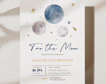 May include: A blue and white invitation with a watercolor illustration of the moon and stars. The text reads "Two the Moon" and "Jake's Second Birthday". The invitation includes the date, time, and location of the party.