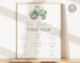 May include: A green and brown tractor illustration with a white background. The text "Jake Dalton's First Year" is at the top of the page. The page lists the child's age, weight, height, favorite books, toys, and foods.