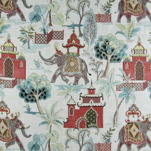 May include: Fabric with a repeating pattern featuring gray elephants adorned with decorative coverings, red pagodas, and stylized trees in shades of blue and green. The design is set against a cream-colored background, creating a whimsical, yet elegant aesthetic.