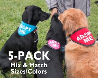May include: A 5-pack of dog bandanas in blue, pink, and red with the text "Adopt Me" and a paw print. The bandanas are designed to be worn around a dog's neck.