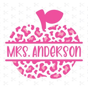 May include: Pink apple with a leopard print design and the text "MRS. ANDERSON" in a white banner across the middle.