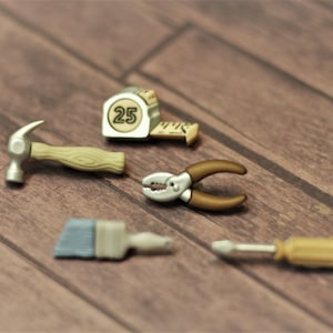 Tools: Medium to Large-sized Tape Measure, Hammer, Pliers, Paintbrush, Wrench, Ladder, Paint can and Screwdriver Stud Earrings!