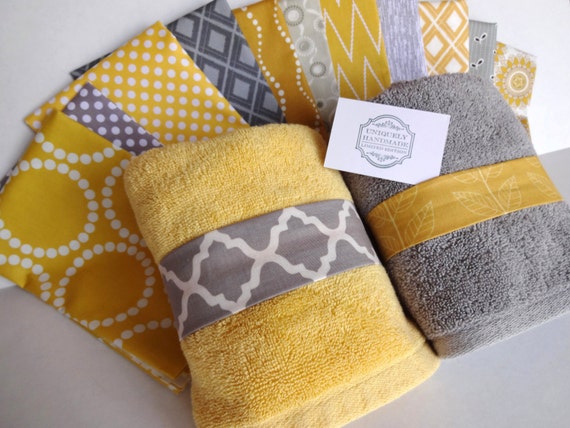 yellow and grey bath towels