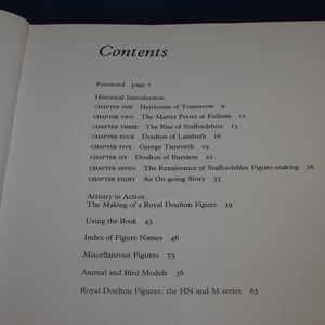 May include: A book titled "Royal Doulton Figures" with a table of contents listing chapters on the history of the company, including the rise of Staffordshire, Doulton of Lambeth, and the Renaissance of Staffordshire figure-making. The book also includes sections on artistry in action, using the book, and an index of figure names.
