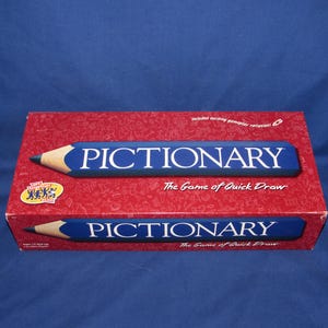 May include: A red box of the Pictionary game. The box has a blue pencil design with the word "PICTIONARY" in white. The game's tagline, "The Game of Quick Draw," is also visible.