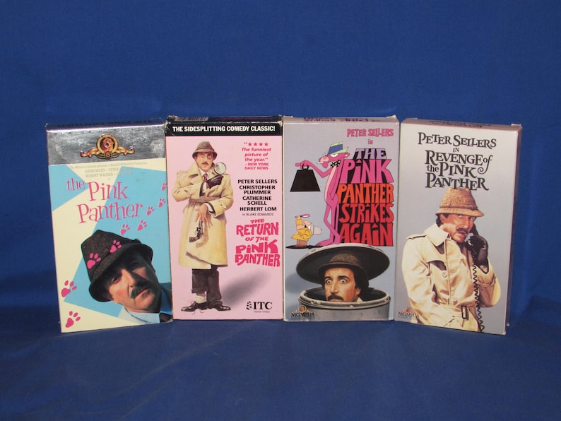 May include: Four VHS tapes featuring "The Pink Panther" movies. Titles include "The Pink Panther," "The Return of the Pink Panther," "The Pink Panther Strikes Again," and "Revenge of the Pink Panther." Each tape has colorful artwork and text.