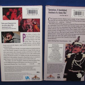 May include: Two VHS tapes featuring Peter Sellers in "The Pink Panther Strikes Again" and "Revenge of the Pink Panther." The covers display images of the actor and film stills, with text and logos. The tapes are in a blue setting.