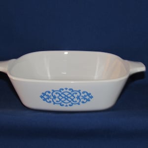 May include: White ceramic baking dish with blue floral design.