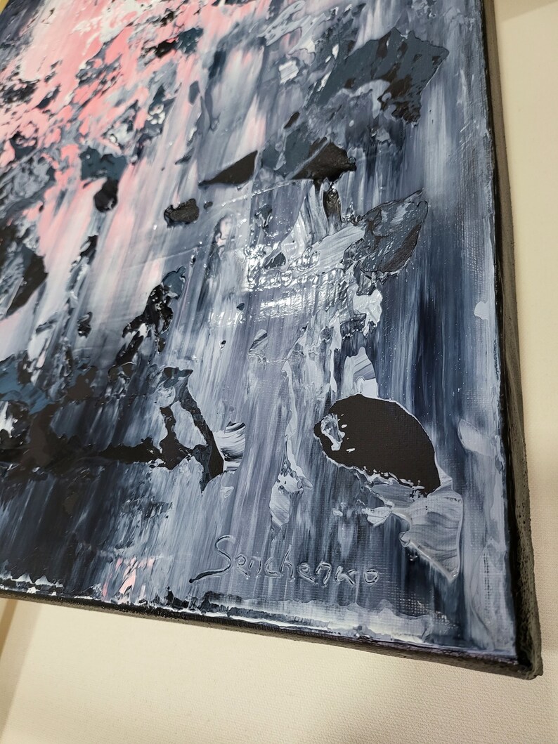 May include: Abstract painting with a mix of black, white, and pink paint. The painting has a textured surface and is signed "Senchenko" in the bottom right corner.