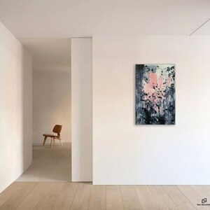May include: Abstract painting with pink, white, and gray colors. The painting is hanging on a white wall in a modern room.