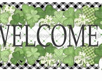 May include: A welcome sign with a black and white checkered background and green shamrock designs. The word "WELCOME" is in black letters. The sign is decorated with green shamrocks and a small floral wreath.