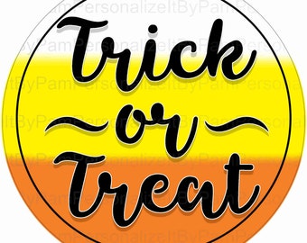 May include: A round, orange, yellow, and white Halloween sign with the text "Trick or Treat" in black cursive lettering.
