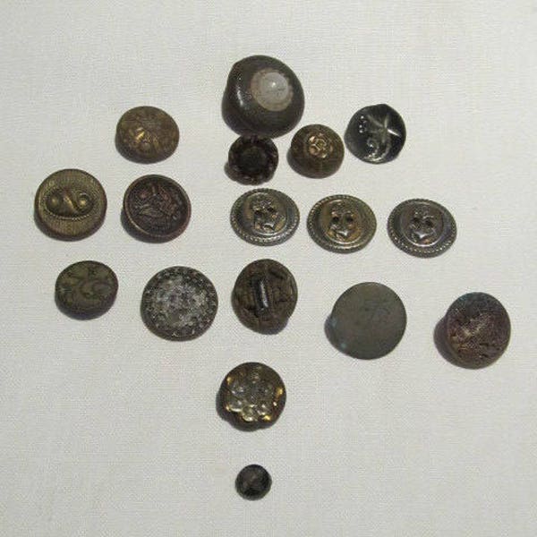 Bronze carved and picture buttons x 17; unique mixture; some ship anchors and coat of arms, floral; all metal shanks; Victorian