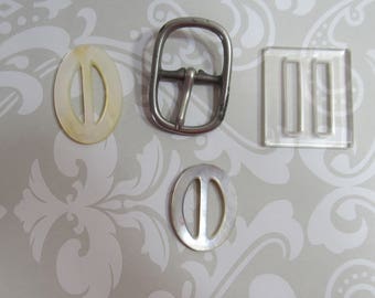 Antique buckles x 4; two nacre and one clear hard plastic and one metal; 1940's