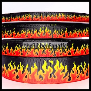 May include: Close-up of several black ribbons with a flame design in red, orange, and yellow. The ribbons are stacked on top of each other, with the text "theRibbonFanatic" visible on one.
