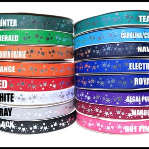 May include: A collection of 14 rolls of silver star patterned ribbon in various colors, including teal, hunter, emerald, Carolina/Copen, navy, longhorn orange, orange, red, white, gray, black, regal purple, maroon, and hot pink.
