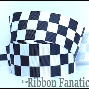 May include: A roll of black and white checkered ribbon. The ribbon has a repeating pattern of black and white squares. The text "the Ribbon Fanatic" is at the bottom of the image.