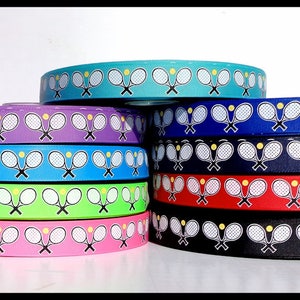 May include: Assortment of colorful ribbon with a white tennis racket and yellow tennis ball design. The ribbon is available in turquoise, purple, blue, green, pink, and black.