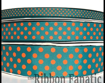 May include: Teal and orange polka dot ribbon. The ribbon is shown in three rolls.