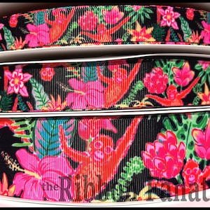 May include: Black and white ribbon with a repeating pattern of pink hibiscus flowers, green leaves, and red monkeys swinging from vines. The ribbon is made of grosgrain fabric and has a satin finish.
