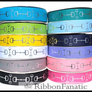 May include: A stack of 10 rolls of ribbon with a silver equestrian stirrup design on a variety of colored backgrounds, including teal, green, yellow, white, gray, black, and pink. The ribbon is arranged in a semi-circle with the text "the RibbonFanatic" at the bottom.