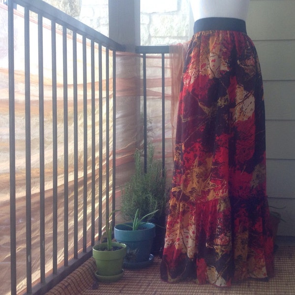 red floral maxi skirt ; one of a kind ; red orange and yellow flower patterned floor length skirt with black elastic waistband