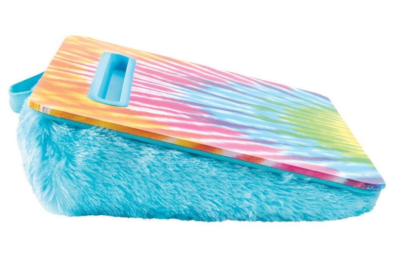 May include: A blue and white fuzzy pillow with a tie-dye patterned hard surface on top. The hard surface has a blue handle.