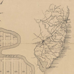 May include: A black and white map of the area around Philadelphia, Pennsylvania, showing the surrounding towns and cities, including Camden, New Jersey, and Atlantic City, New Jersey. The map also shows the Delaware River and the Delaware Bay.